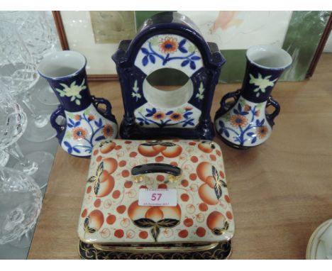 A vintage mantle piece set of ceramics vase pair and watch stand with butter dish