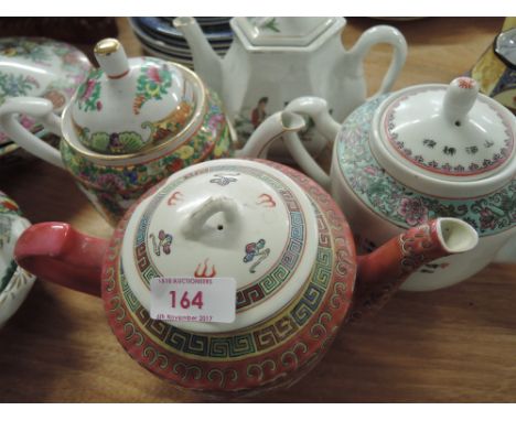 A selection of vintage oriental ceramic teapots 