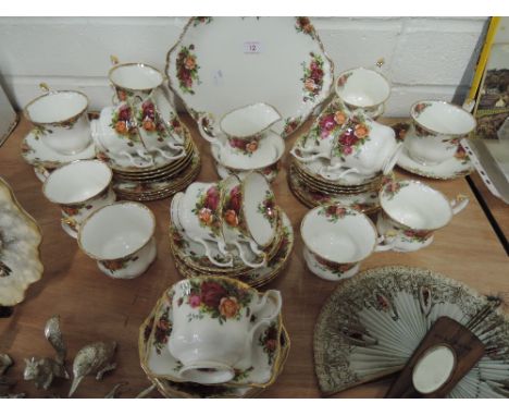 A part tea service by Royal Albert in the old country rose pattern 40 pieces approx