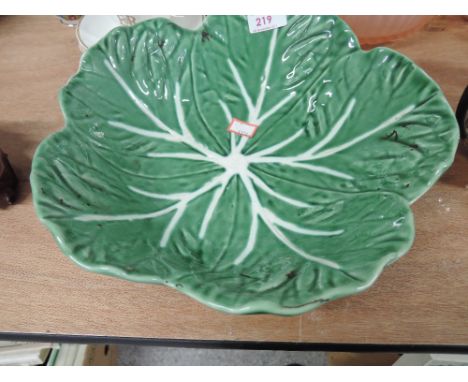 A vintage ceramic bowl decorated as large life like leaf