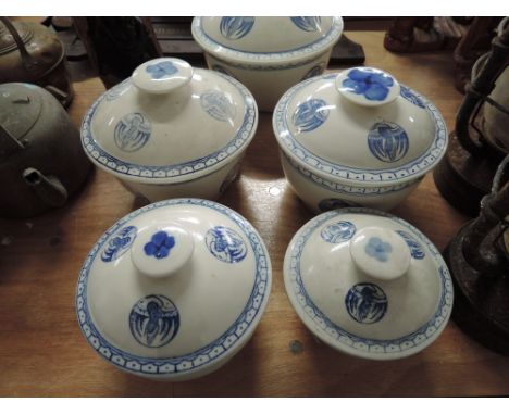 A selection of vintage oriental ceramic lidded jars of graduated form 
