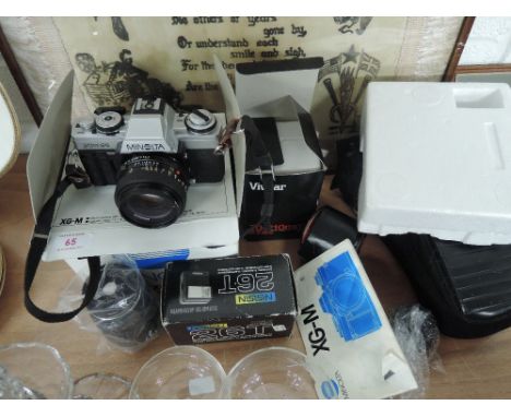 A selection of photographic equipment including Minolta XG-M camera, Vivitar lenses etc