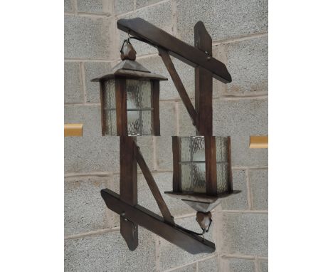 A vintage oak framed lantern style standard lamp