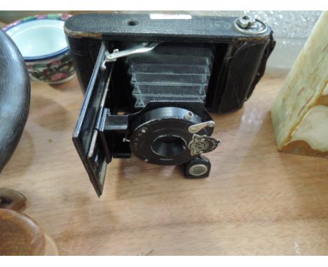 A vintage folding camera The Universe