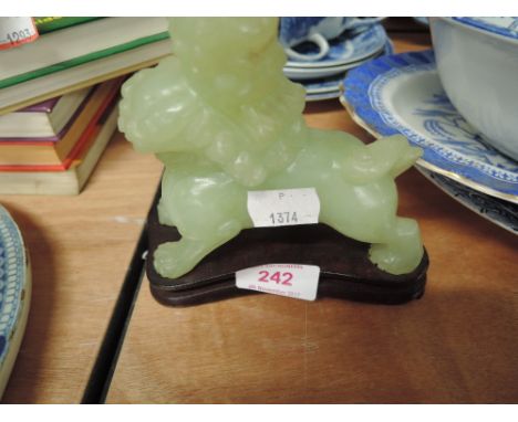 A carved jade stone figure in the form of a dog of Fo