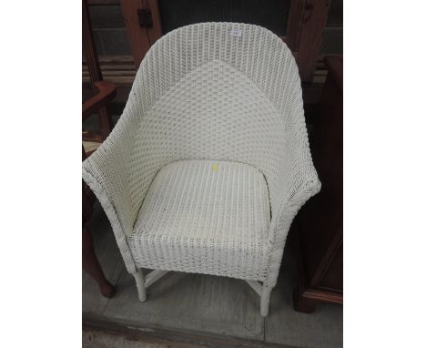 A vintage Lloyd Loom style tub chair of double woven design 