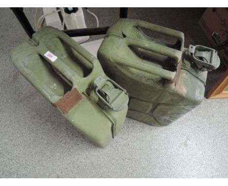 Two vintage army jerry petrol cans in classic khaki green