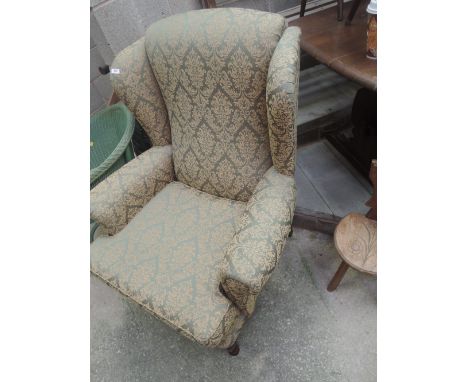 A modern wing back armchair by Jade holdings