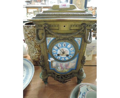 An antique heavy brass cast regency style mantle clock with enamel face and decor (AF)
