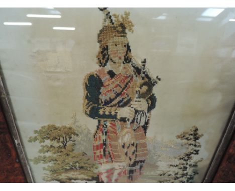 An antique needle work sampler tapestry a Scots man highlander with bagpipes