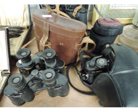 A selection of vintage binoculars including Prinz, a Minolta X700 camera and Miranda lens