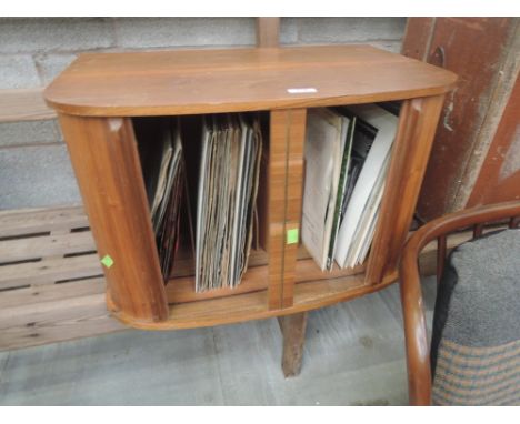 A vintage record cabinet and contents