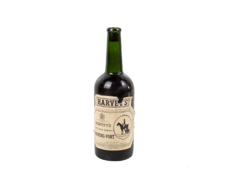 A vintage bottle of Harvey's Fine Old Tawny Hunting Port.  Condition Report: Damage to the cork