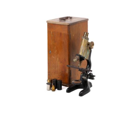 A Bausch and Lomb Optical Co monocular microscope. With two eye pieces (5, 10) and three objective lenses (4mm, 16mm, the thi