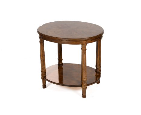 A oak quarter veneer oval side table. Having a slide at one end, raised on four square supports united by an under shelf. H62