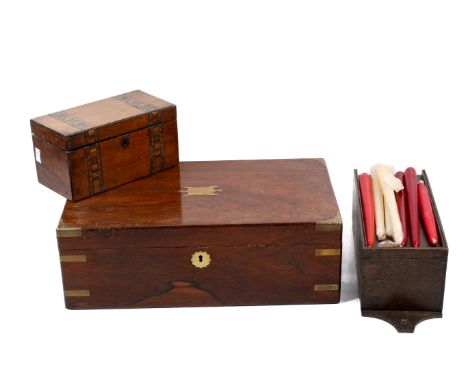 A collection of three Victorian wooden boxes. Including a mahogany brass bound writing slope, a tea caddy and a candle box. M