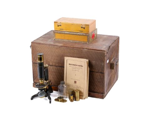 A Wheeler London brass monocular microscope. With one eye piece and two cased objective lenses, all unmarked. Together with a