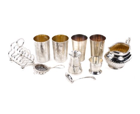 An assortment of silver and silver plate. Comprising four silver plated beakers, two with engraved oriental decoration. A sil