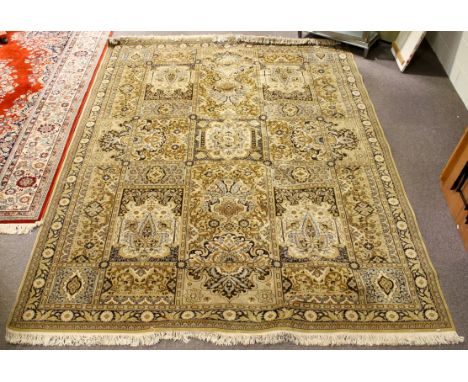A Belgian National Carpet Institute cream ground wool rug. Multiple geometric borders and bordered panels with floral motifs.