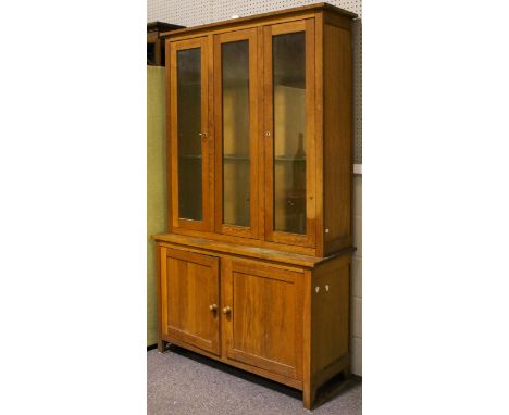A contemporary illuminated display cabinet cupboard. A glazed two door top section opening to reveal two adjustable shelves a