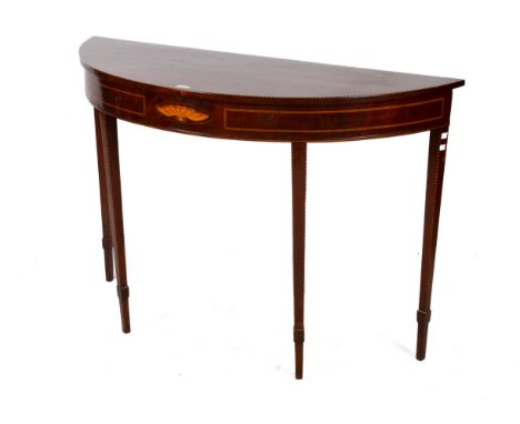 A George III mahogany and satinwood demi-lune console table. Having inlay to the top, ebonised stringing and shell marquetry,