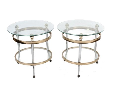 A pair of glass top coffee tables. Of gilt metal circular form with three supports and a lower shelf. H60cm x Diameter 60cm
