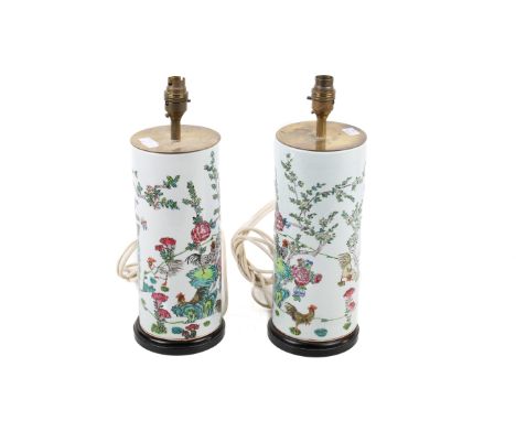 A pair of 20th century Chinese ceramic table lamp bases. Cylinder vases decorated with chickens raised on hardwood stands. H3