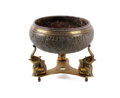 An Anglo Indian brass planter on an elephant stand. Stand of trefoil form with elephant holding their trunks aloft. H23cm