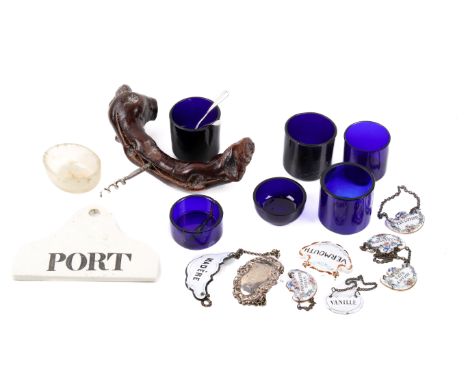 An assortment of collectables. Including blue glass liners, bottle and decanter labels, a corkscrew and a ceramic 'PORT' labe