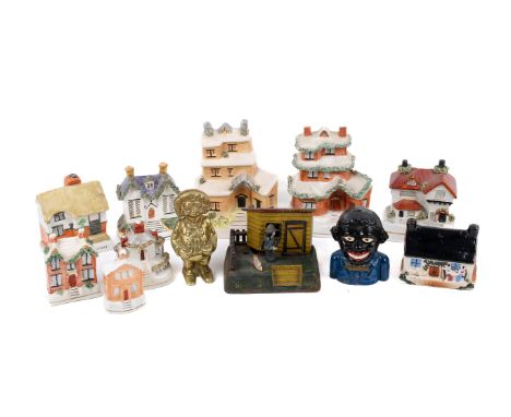 A collection of Victorian and later stoneware and metal money boxes. Mostly modelled as houses. Max. H17cm Notice from the th