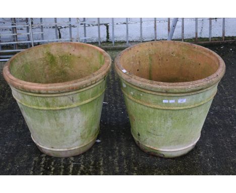 A pair of large ceramic garden pots. H53cm Max. diameter 59cm
