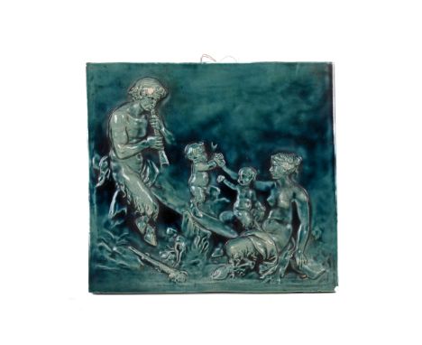A green glazed ceramic wall plaque. Depicting a family of fauns. 33cm x 30cm. (AF).