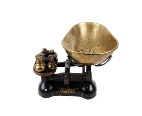 A vintage set of Avery cast iron balance scale. Including brass pan and weights. H33cm