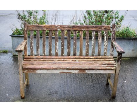 An Alexander Rose teak garden bench. Two seater. H86cm x W127cm x D56cm Condition Report: The pieces of wood are in good cond