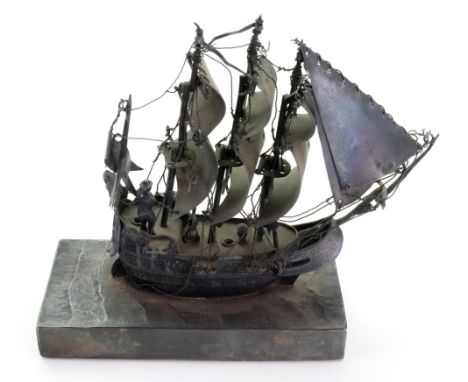 A Dutch late 19th century miniature silver model of a three masted galleon, English hallmarks for London 1881, on a rectangul