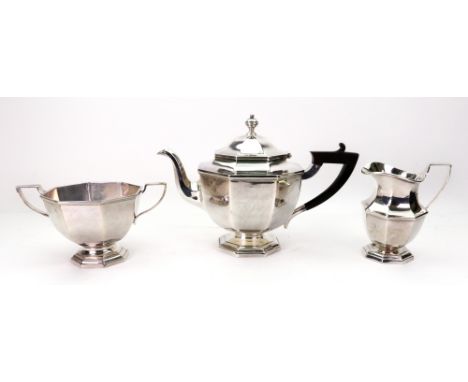 An Art Deco three-piece silver tea service, Mappin & Webb, Sheffield 1922, of octagonal form, the teapot with blackwood harp 