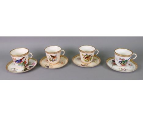 Four Royal Worcester cups and saucers, circa 1880, each painted with birds in branches and beneath a gilt and white beaded bo