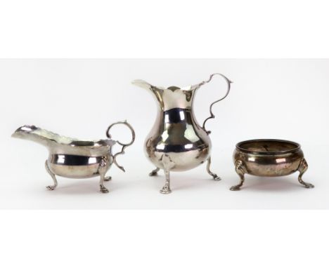 A George III silver pear shape cream jug, Samuel Meriton, London 1760, with cut-edge, on three scroll legs and hoof feet, a G