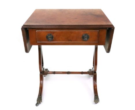 A miniature reproduction Regency style figured walnut boxwood strung sofa table, with frieze drawer, on shaped end standards 