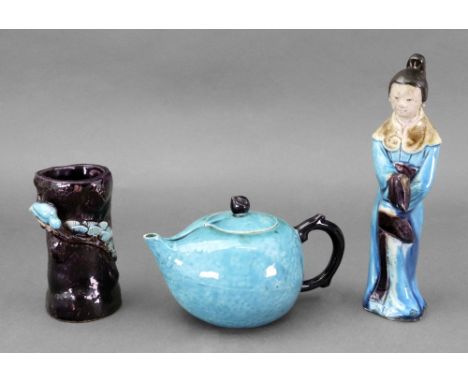 A Chinese turquoise glazed teapot and cover, probably Kangxi, of peach form with aubergine glazed branch handle and a peach k