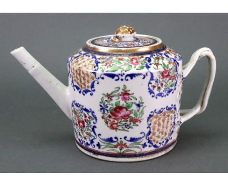 A Chinese cylindrical famille rose teapot, circa 1800, enamelled with flowers inside blue foliate frames, set with entwined s