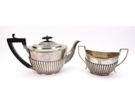 A George III style oval part lobed and fluted silver teapot and sugar basin, Charles Stuart Harris, London 1895 & 1896, the t