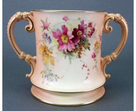 A Royal Worcester presentation two handled loving cup, circa 1911, one side decorated with flowers against a shaded apricot g
