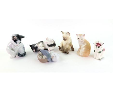 A Plichta pottery figure of a cat, 9cm high, Rosenthal porcelain cat and three Royal Worcester examples and a Lladro figure d
