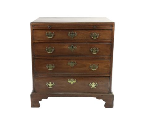 A George III mahogany chest, the moulded rectangular caddy top above a brushing slide and four long drawers, on bracket feet,