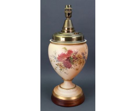 A Royal Worcester lamp, late 19th century, decorated with flowers against a shaded apricot ground, lamp 24cm high, fitted for