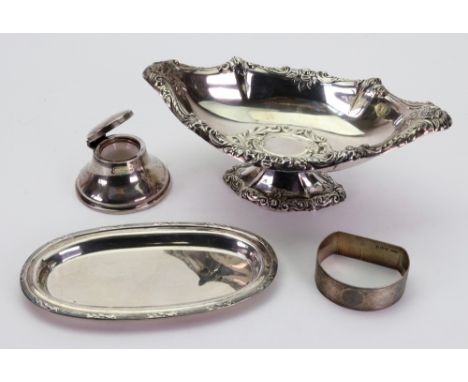 An Edwardian silver lozenge shaped pedestal bon bon dish, English import marks for 1903, foliate embossed, 16.5cm wide, an ov