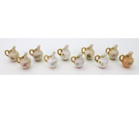 A group of six Royal Worcester miniature jugs, circa 1910 and later, each painted with a bird, puce printed marks, 4cm high a
