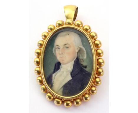 An oval portrait miniature, depicting a gentleman, wearing a blue jacket, displayed in an oval frame with twist rope and circ