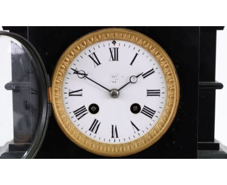 A French black marble bronzed and gilt metal mounted mantel clock, circa 1870, in architectural style case, the white enamel 